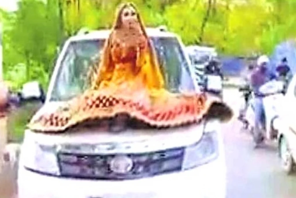 bride on car bonnet