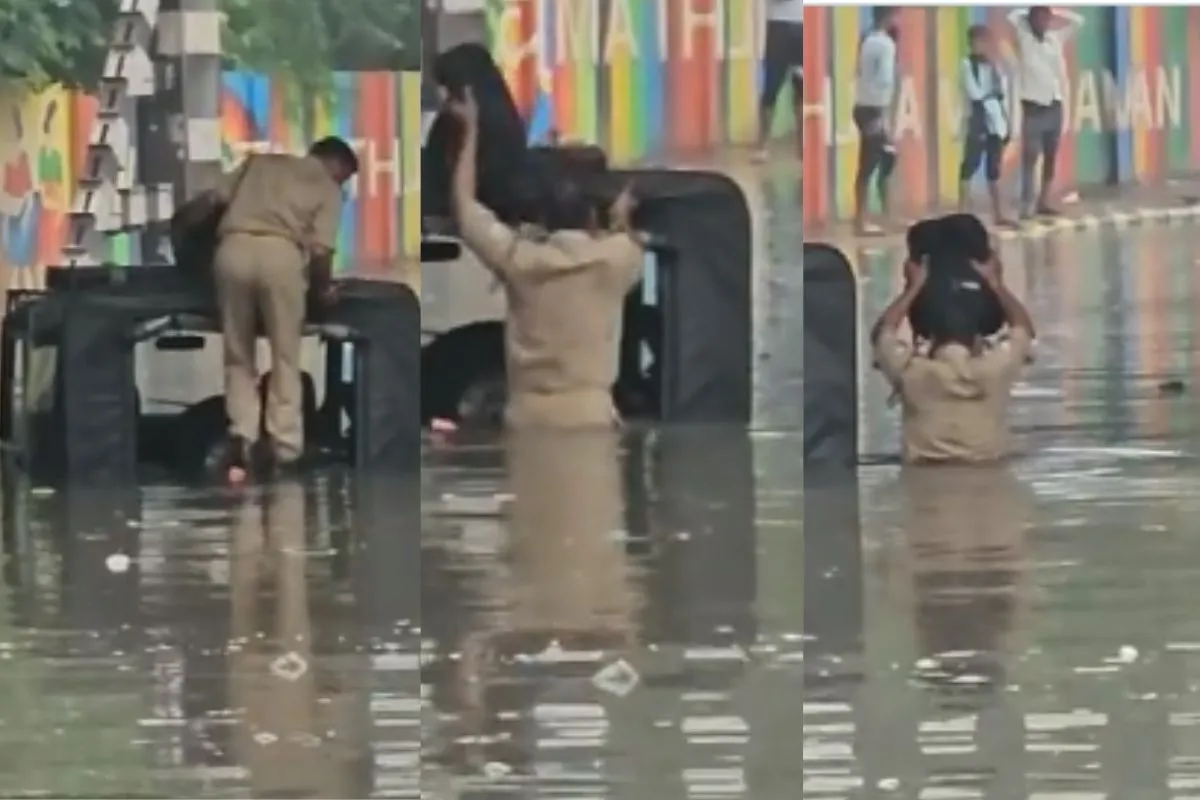 VIDEO: बारिश के बाद सड़क बनी तालाब, डूबी पुलिस की जीप, हाथ में बैग उठाए सीने तक पानी में चलकर बाहर निकले सिपाही जी