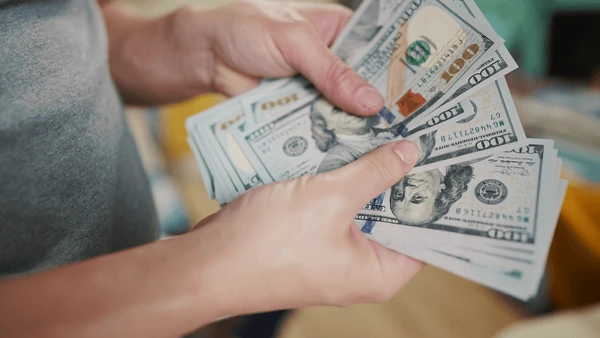 dollar-money-bankrupt-man-counting-600nw-2163471943