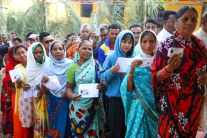 Voters show their identity cards as they wait in a queue to cast their votes for Chhattisgarh Assembly elections in Narharpur on Tuesday, November 07, 2023. (Photo: IANS/@CEOChhattisgarh)