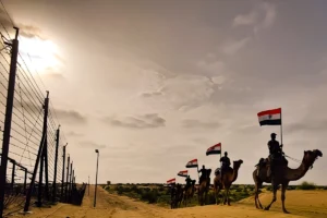 Caption : Jaisalmer: Border Security Force on camels during Tiranga Yatra ahead of 78th Independence Day celebration in Jaisalmer on Wednesday, August 14, 2024.(IANS)