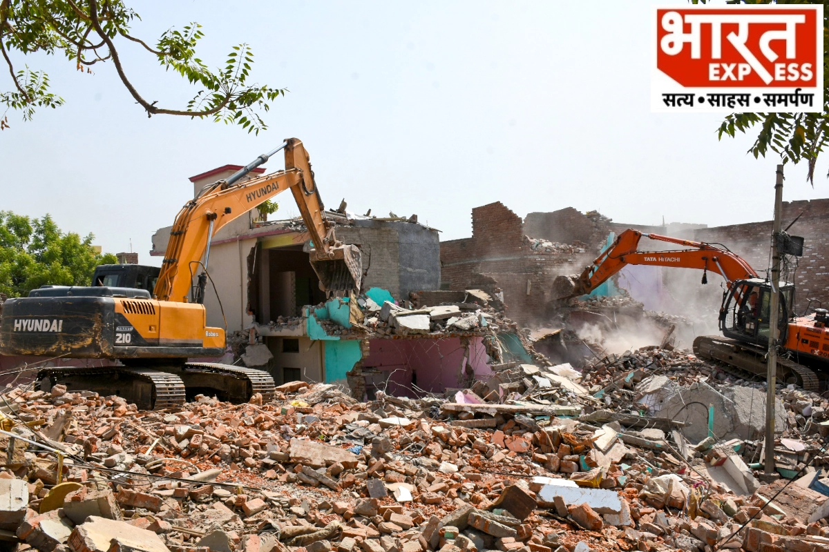 Caption : Lucknow: Bulldozer being used to demolish houses illegally built in Kukrail River’s catchment area on the orders of Allahabad High Court , at Akbar Nagar area, in Lucknow, Saturday, June 15, 2024.(IANS/Phool Chandra)